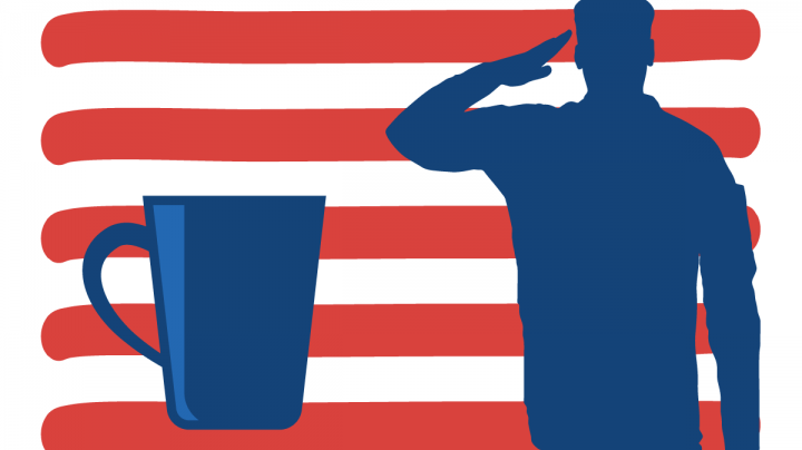 A veteran with a cup of coffee in front of am american flag